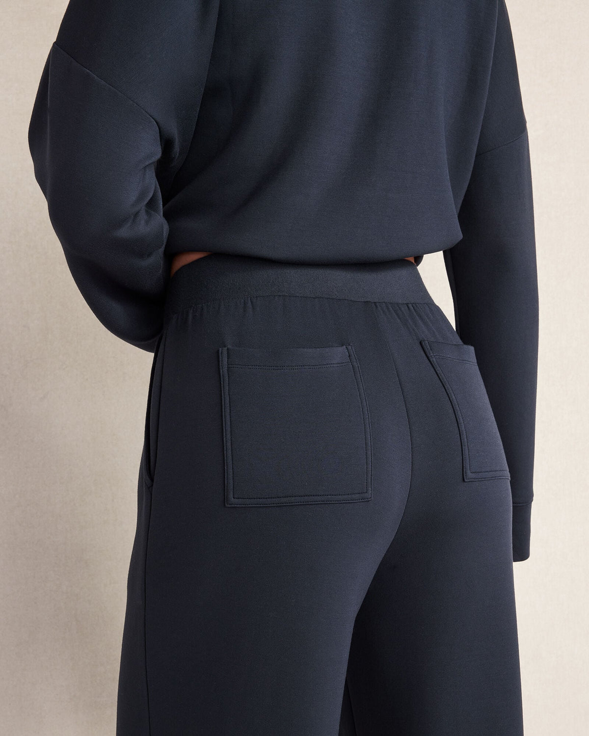 SOFT KNIT WIDE LEG PLEATED PANTS